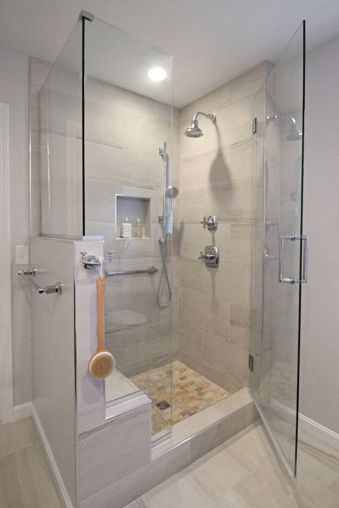Example of a mid-sized transitional master gray tile and porcelain tile porcelain tile corner shower design in Boston with shaker cabinets, dark wood cabinets, a two-piece toilet, gray walls, an undermount sink and quartz countertops