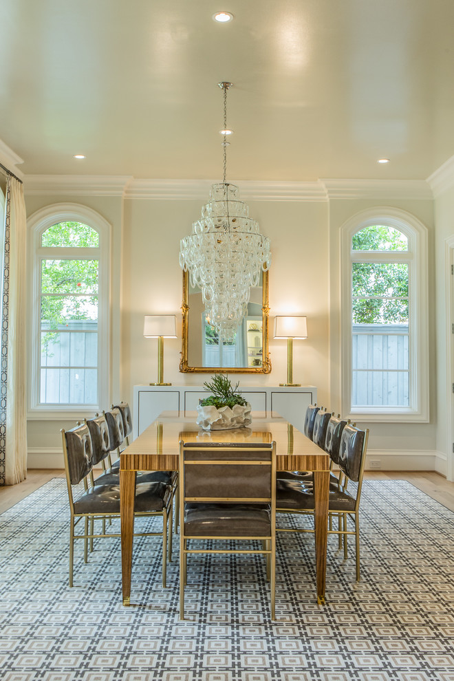 Photo of a transitional separate dining room in Dallas with beige walls, light hardwood floors and no fireplace.