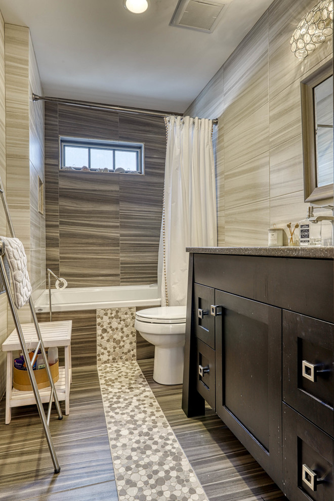 Mid-sized country 3/4 bathroom in Vancouver with recessed-panel cabinets, dark wood cabinets, an alcove tub, a shower/bathtub combo, a one-piece toilet, gray tile, beige walls, a drop-in sink, brown floor, a shower curtain and grey benchtops.
