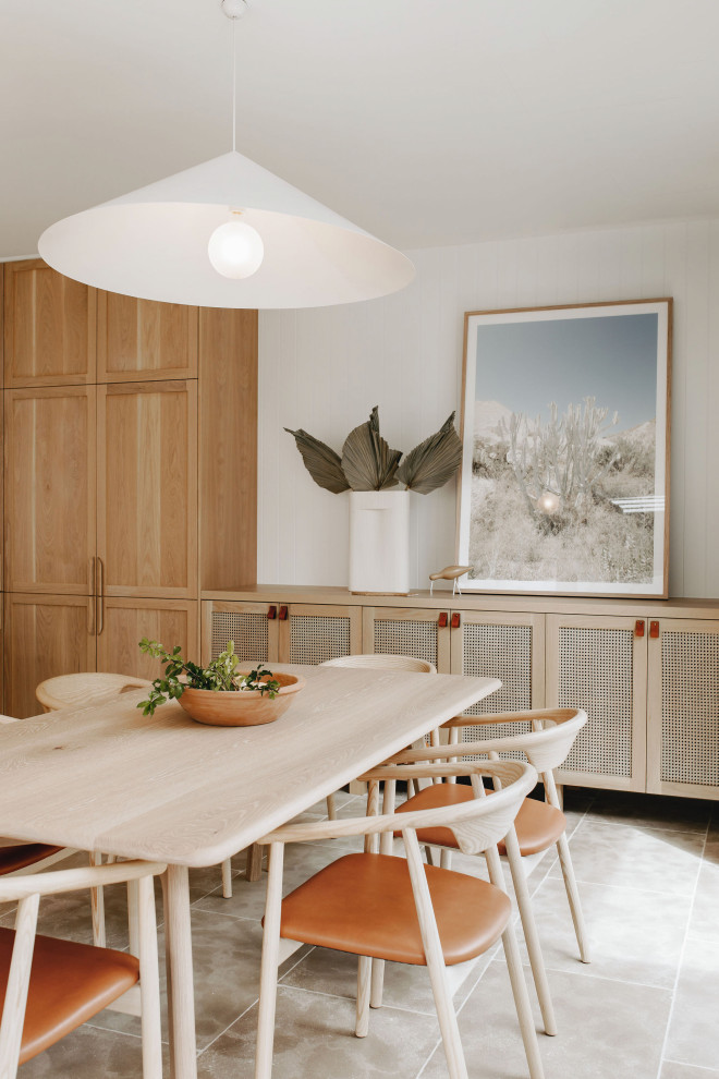 Inspiration for a large scandinavian l-shaped open plan kitchen in Adelaide with a farmhouse sink, recessed-panel cabinets, light wood cabinets, quartz benchtops, beige splashback, ceramic splashback, black appliances, limestone floors, with island and white benchtop.