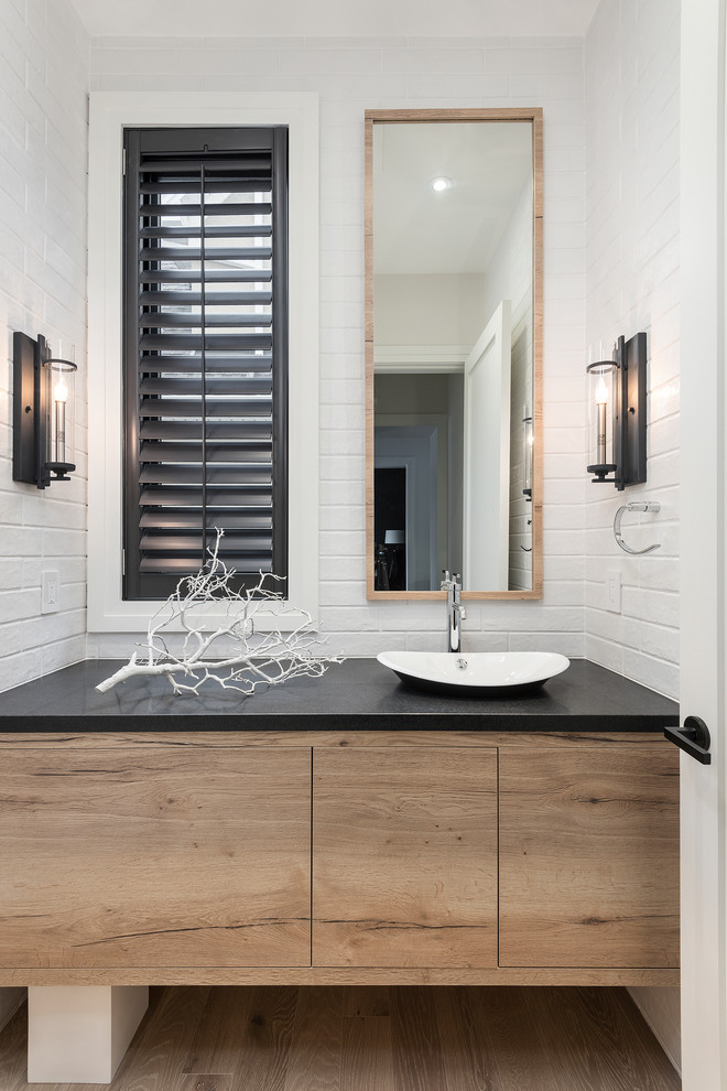 Example of a transitional powder room design in Toronto