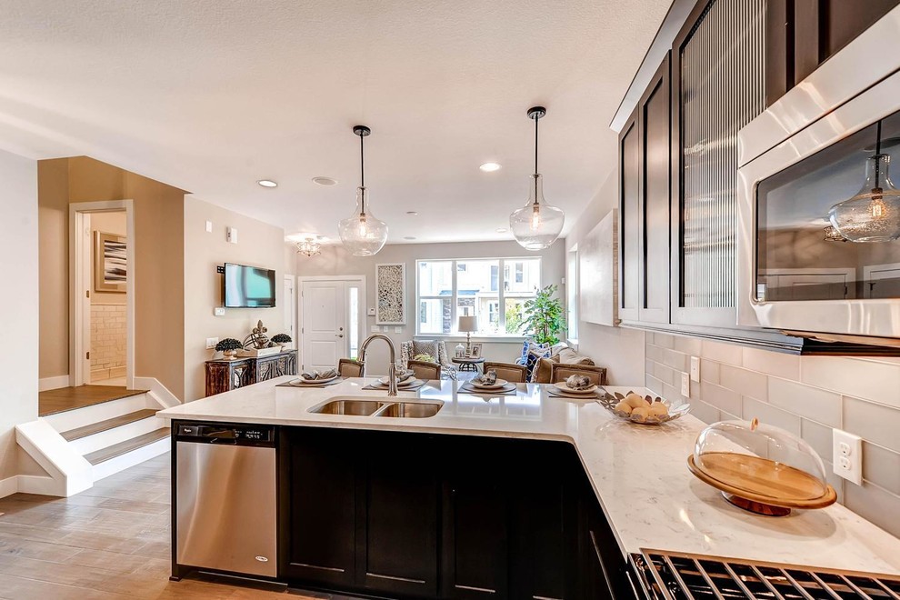 Example of a transitional kitchen design in Denver