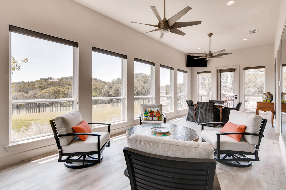 This is an example of a transitional sunroom in Austin.