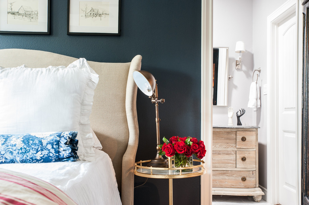 This is an example of a mid-sized transitional guest bedroom in Austin with blue walls.