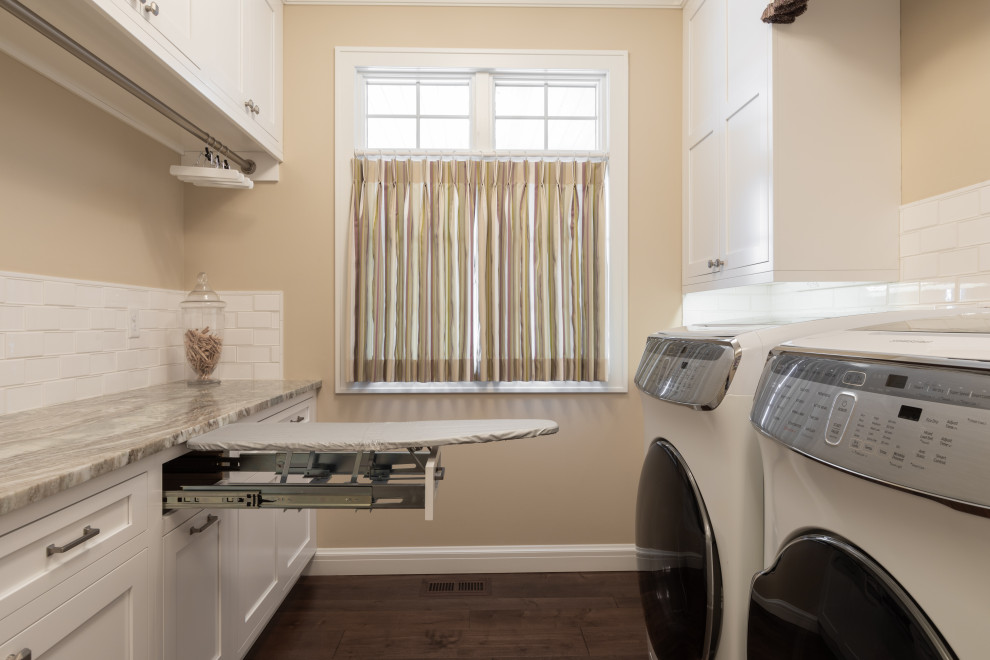 This is an example of a mid-sized traditional laundry room in Other.