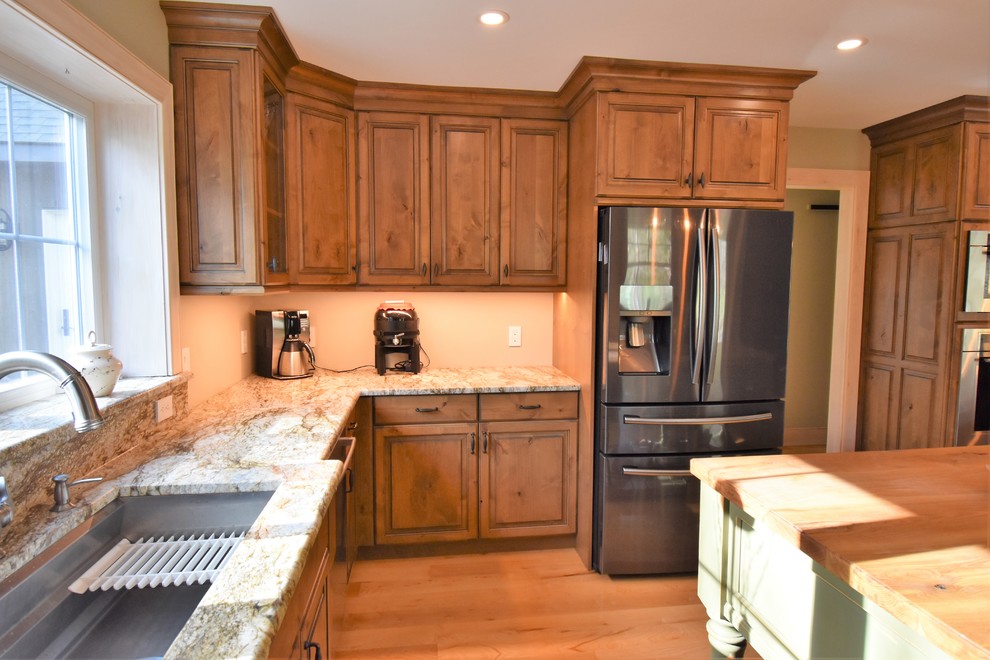 Huge mountain style kitchen photo with distressed cabinets