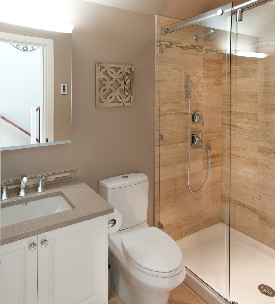 This is an example of a large contemporary 3/4 bathroom in Vancouver with an undermount sink, raised-panel cabinets, white cabinets, engineered quartz benchtops, an alcove shower, a two-piece toilet, multi-coloured tile, stone tile, grey walls and travertine floors.