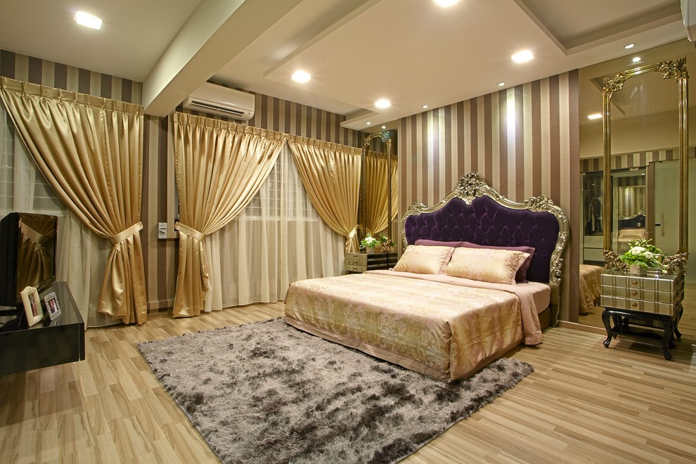 Large arts and crafts master bedroom in Singapore with brown walls and laminate floors.