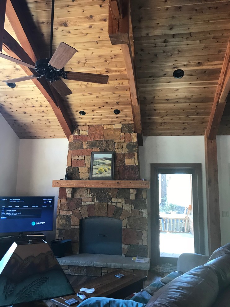 Example of a mountain style home design design in Denver