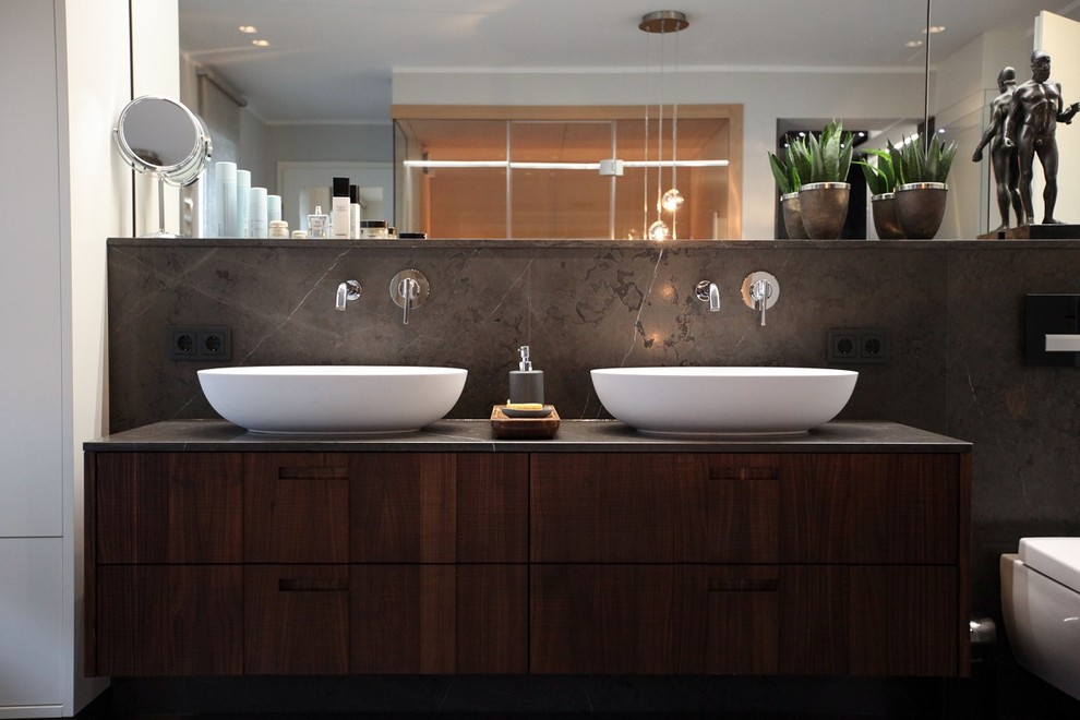 Inspiration for a large contemporary master bathroom in Dortmund with flat-panel cabinets, brown cabinets, a freestanding tub, a curbless shower, ceramic floors, a trough sink, wood benchtops and brown floor.