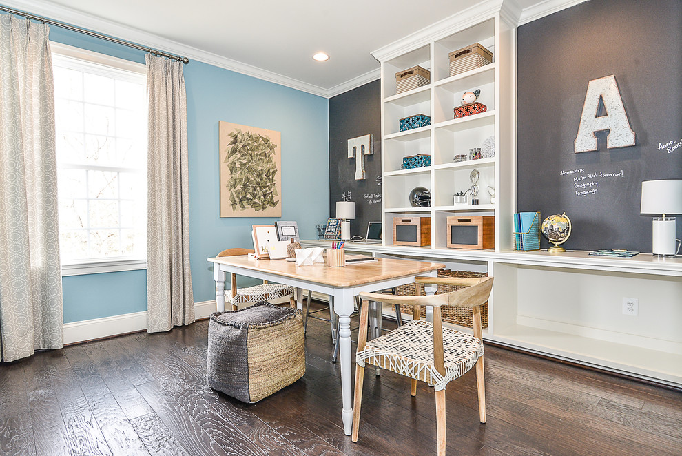 Photo of a mid-sized transitional craft room in DC Metro with multi-coloured walls, dark hardwood floors, no fireplace and a freestanding desk.