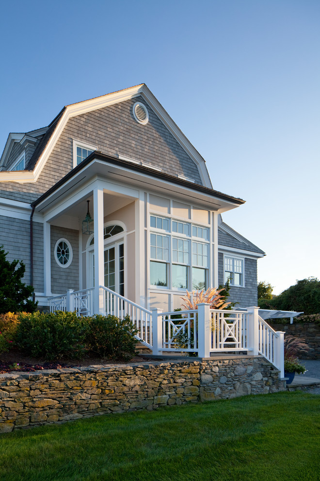 Mid-sized beach style two-storey grey exterior in Providence with wood siding and a gambrel roof.