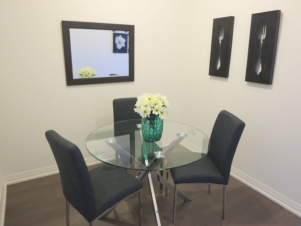 Photo of a small contemporary separate dining room in Toronto with grey walls and dark hardwood floors.