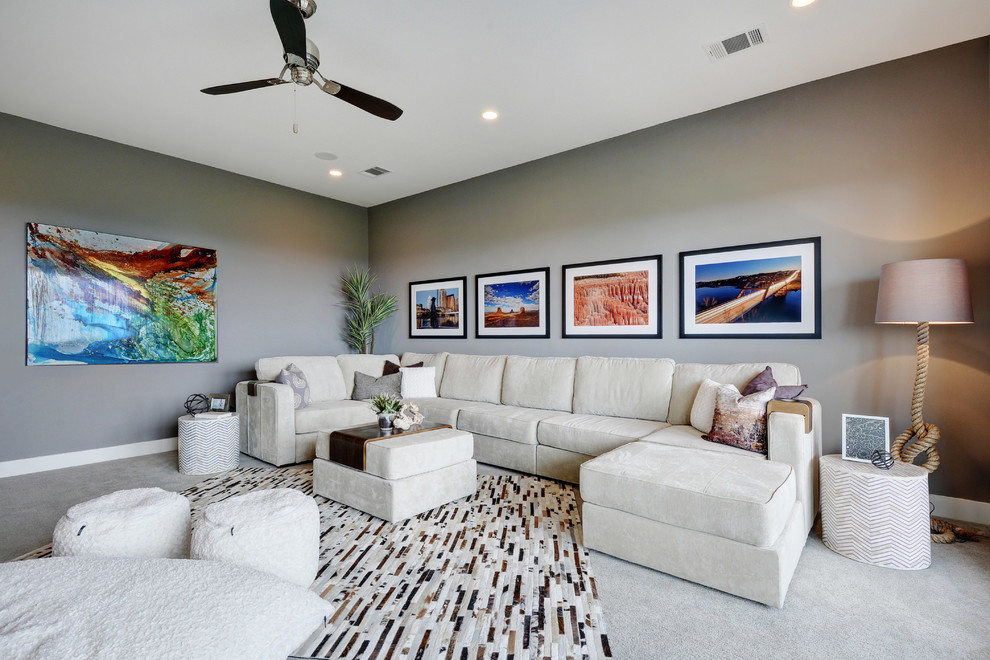 Inspiration for a large contemporary enclosed home theatre in Austin with grey walls and carpet.