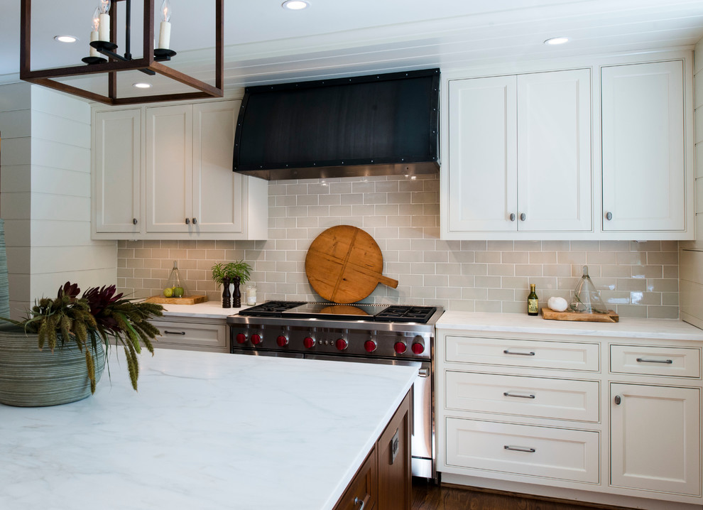 Inspiration for a transitional medium tone wood floor open concept kitchen remodel in Atlanta with beaded inset cabinets, white cabinets, ceramic backsplash and an island