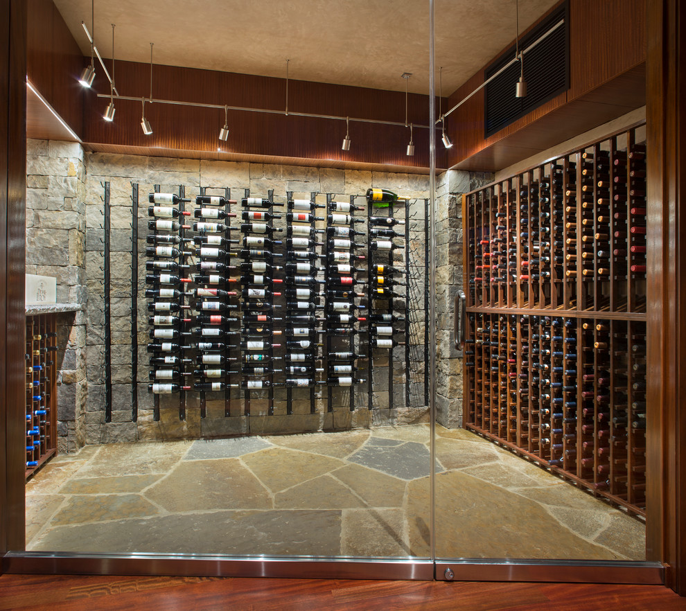 Inspiration for a contemporary brown floor wine cellar remodel in Denver with storage racks