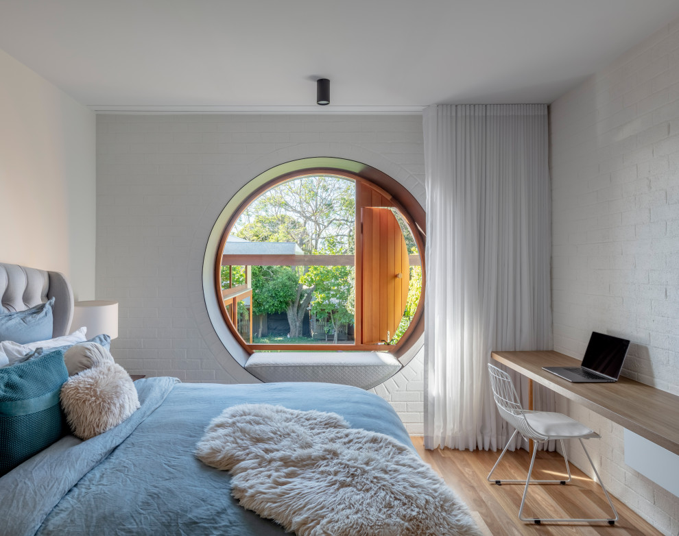 Photo of a midcentury bedroom in Sydney.