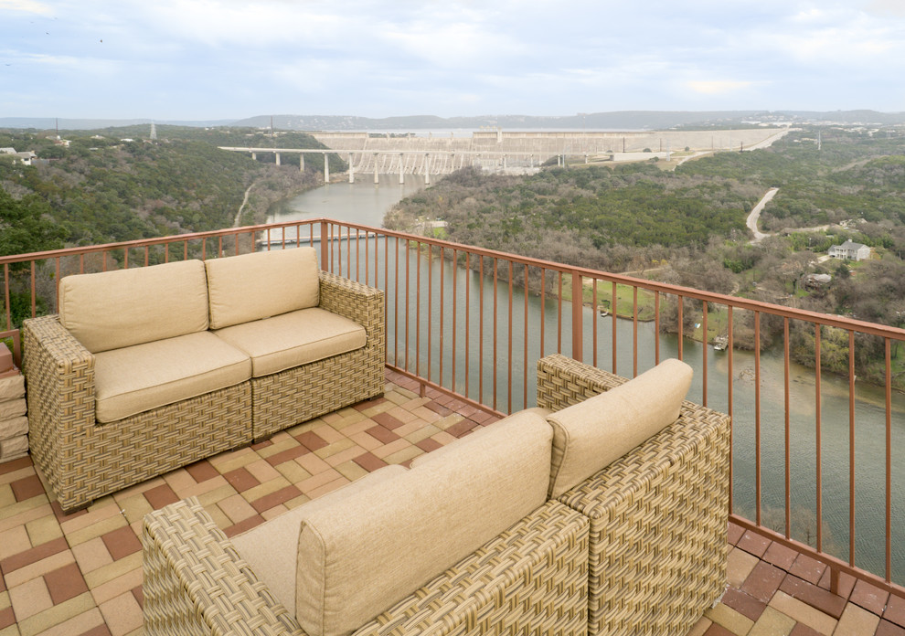 Expansive mediterranean rooftop deck in Austin with no cover.