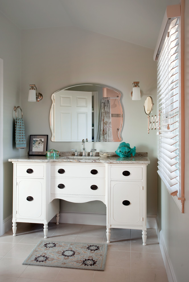 Design ideas for a beach style bathroom in Providence with an undermount sink, white cabinets, granite benchtops, a two-piece toilet, beige tile and flat-panel cabinets.