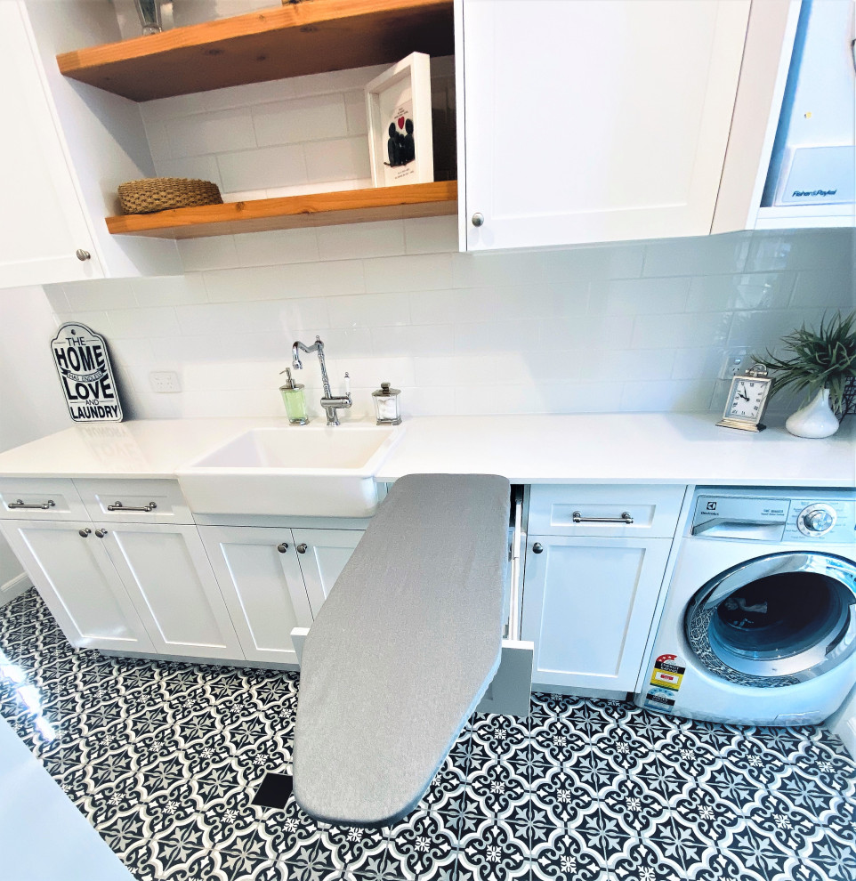 Photo of a beach style laundry room in Brisbane.