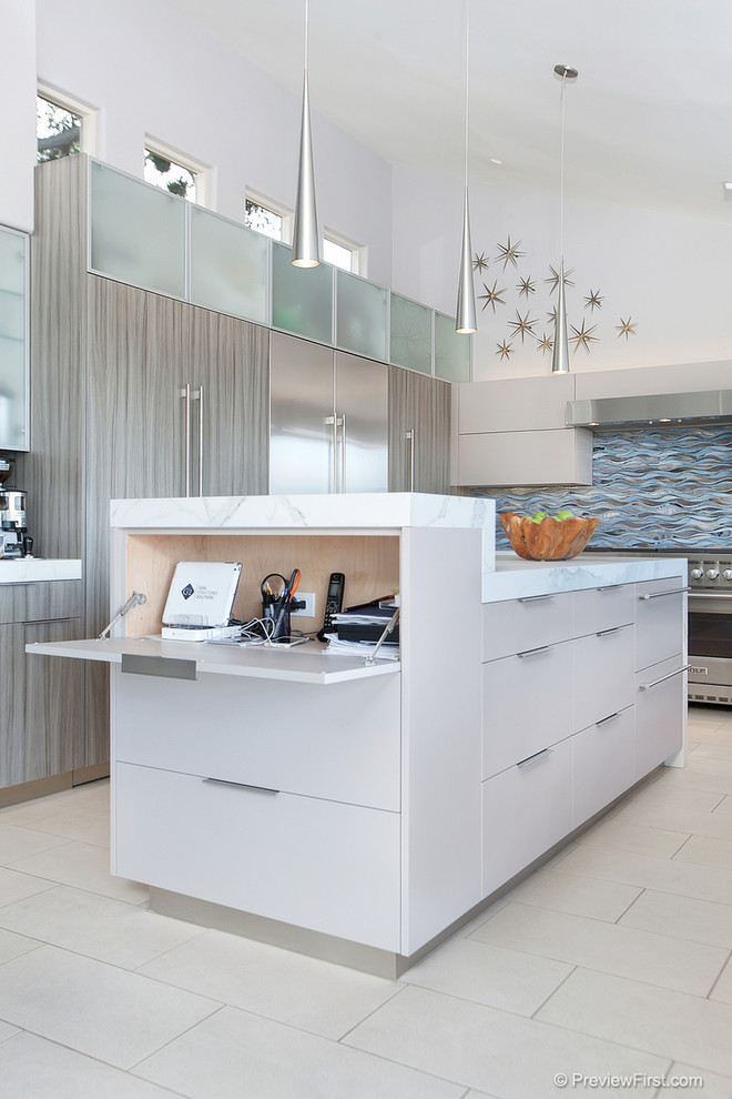 This is an example of a large contemporary u-shaped open plan kitchen in San Diego with an undermount sink, flat-panel cabinets, grey cabinets, blue splashback, glass tile splashback, stainless steel appliances, porcelain floors and with island.
