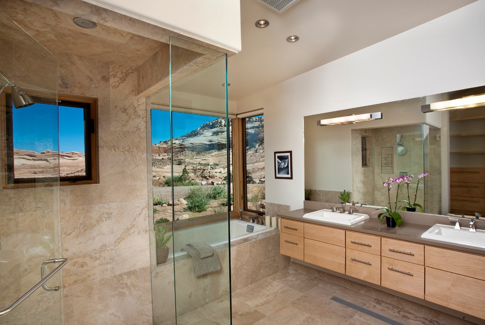 Inspiration for a bathroom in Salt Lake City with a drop-in sink and travertine.