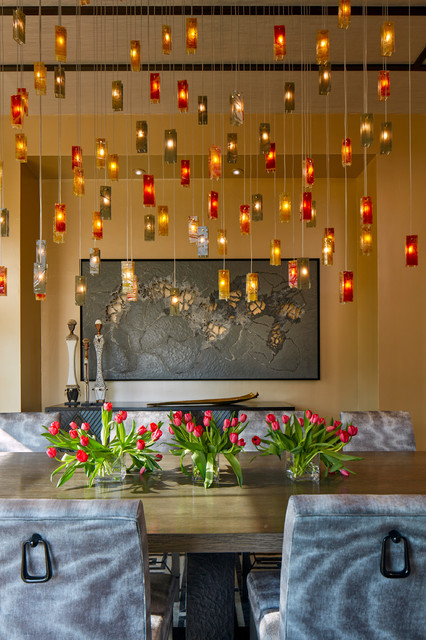 Art Glass Chandelier In Red And Gold Hues In Dining Room
