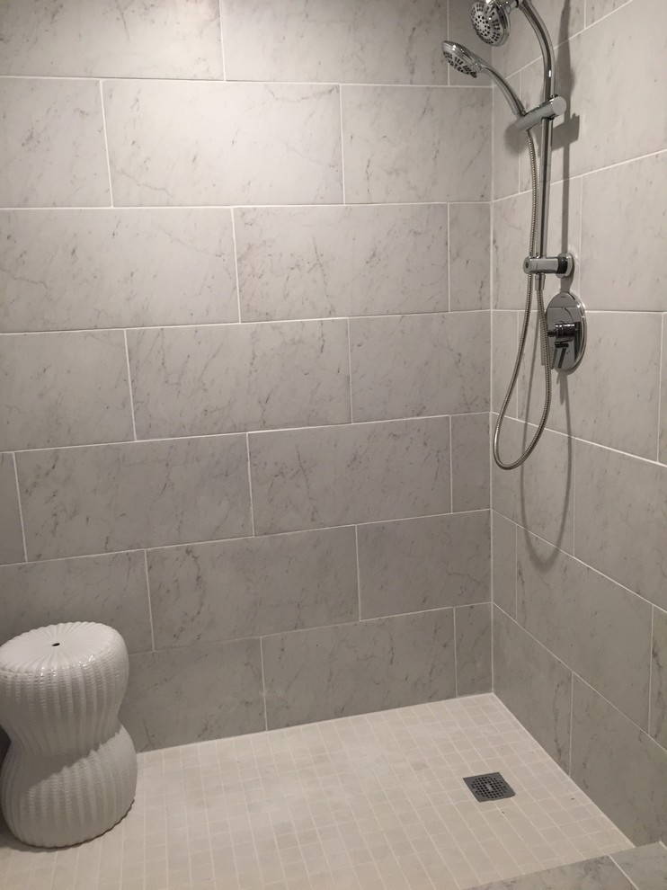 Design ideas for a mid-sized modern master bathroom in Manchester with an alcove shower, white tile, ceramic tile and white walls.