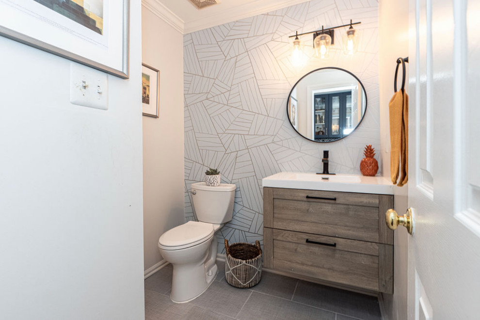 Photo of a small contemporary cloakroom in DC Metro with shaker cabinets, distressed cabinets, a two-piece toilet, grey walls, porcelain flooring, an integrated sink, solid surface worktops, grey floors, white worktops, a floating vanity unit and wallpapered walls.