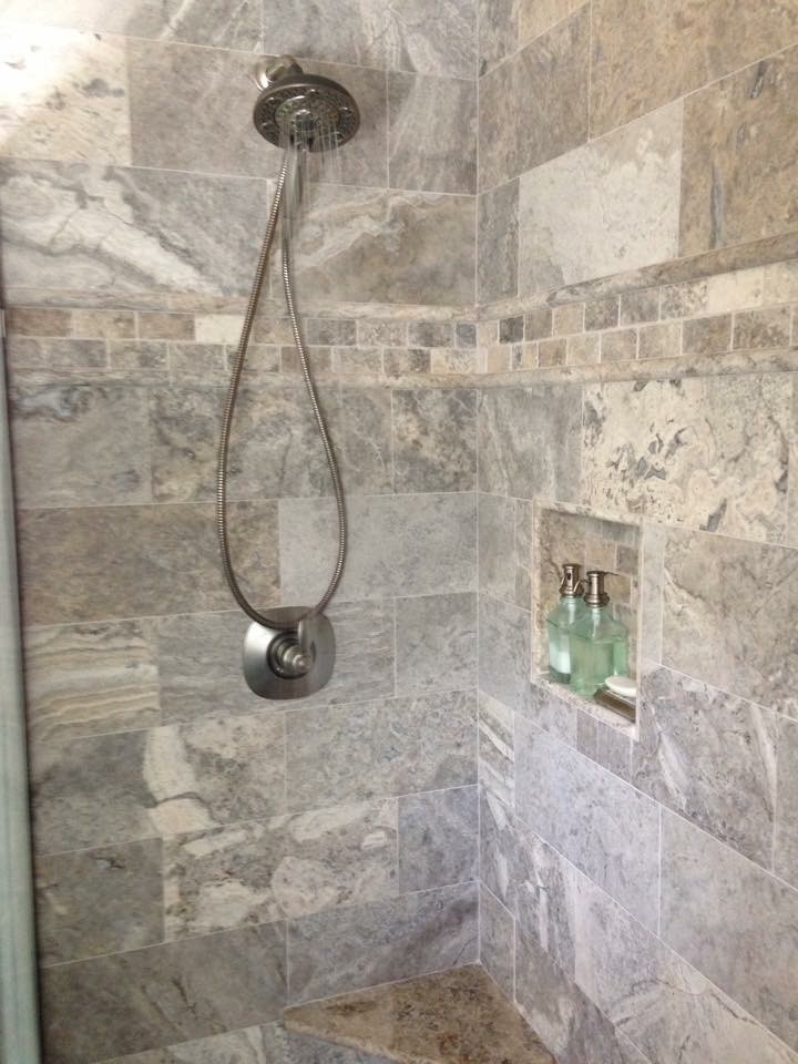 Photo of a mid-sized modern master bathroom in Other with glass-front cabinets, white cabinets, an alcove tub, an alcove shower, beige tile, stone tile, beige walls, porcelain floors, a vessel sink, glass benchtops, beige floor and a sliding shower screen.