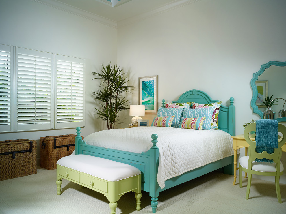 Photo of a tropical bedroom in Miami with white walls and carpet.