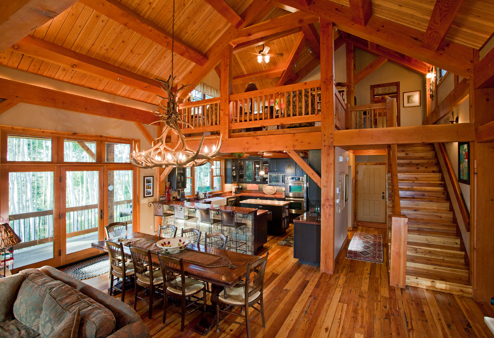This is an example of a country open plan dining in Denver.