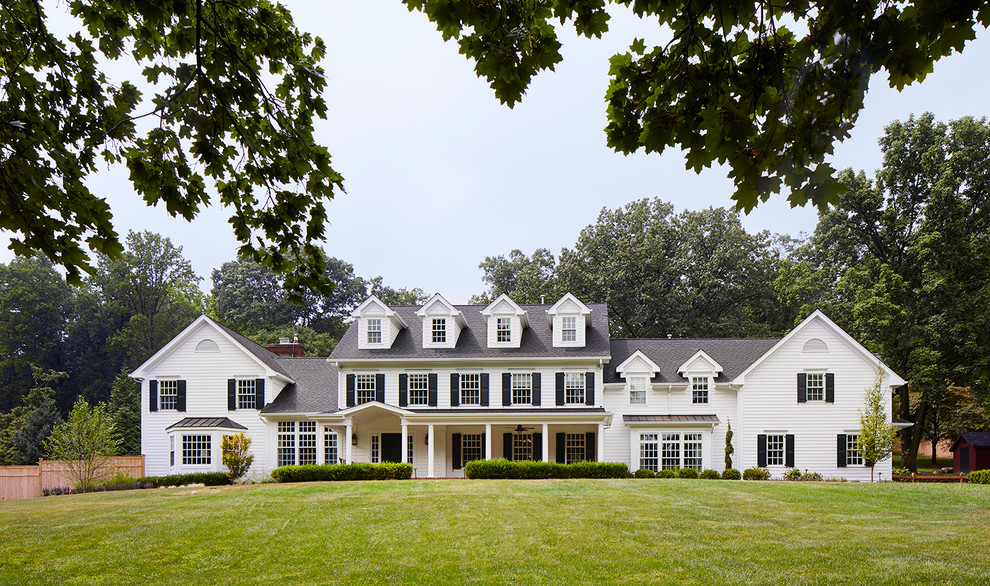 Inspiration for a timeless white three-story gable roof remodel in New York