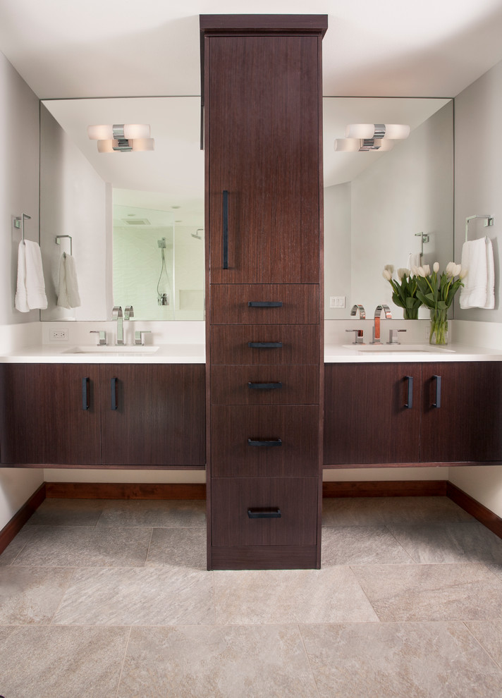 Photo of a mid-sized contemporary master bathroom in Seattle with flat-panel cabinets, dark wood cabinets, a two-piece toilet, white tile, porcelain tile, porcelain floors, an undermount sink, engineered quartz benchtops and white walls.