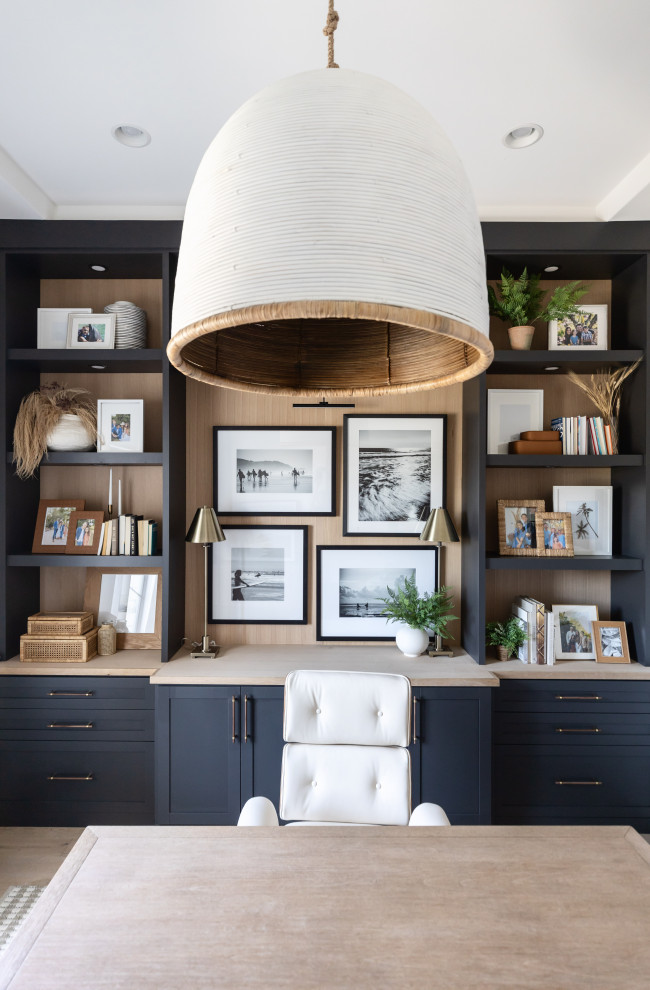 Study room - mid-sized coastal built-in desk coffered ceiling study room idea in Phoenix with white walls