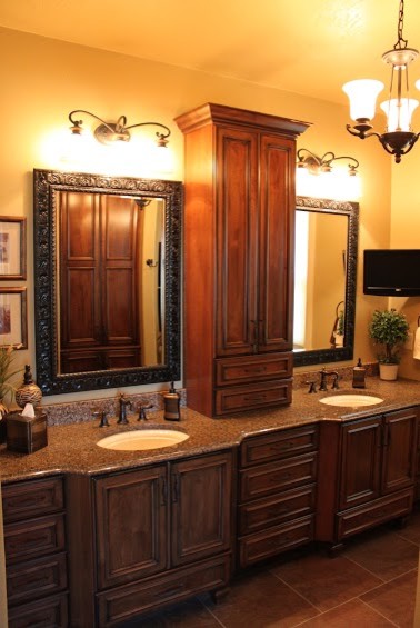 Example of a large master brown tile and ceramic tile ceramic tile bathroom design with an undermount sink, recessed-panel cabinets, dark wood cabinets and quartz countertops