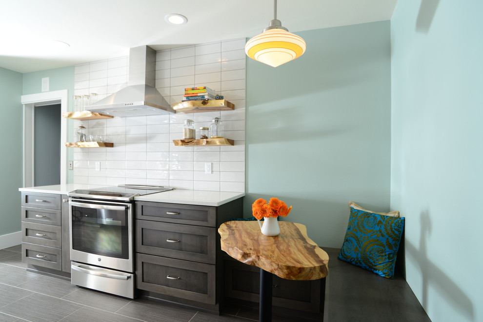 Inspiration for a mid-sized transitional galley vinyl floor eat-in kitchen remodel in Seattle with an undermount sink, shaker cabinets, white cabinets, quartz countertops, white backsplash, cement tile backsplash, stainless steel appliances and no island