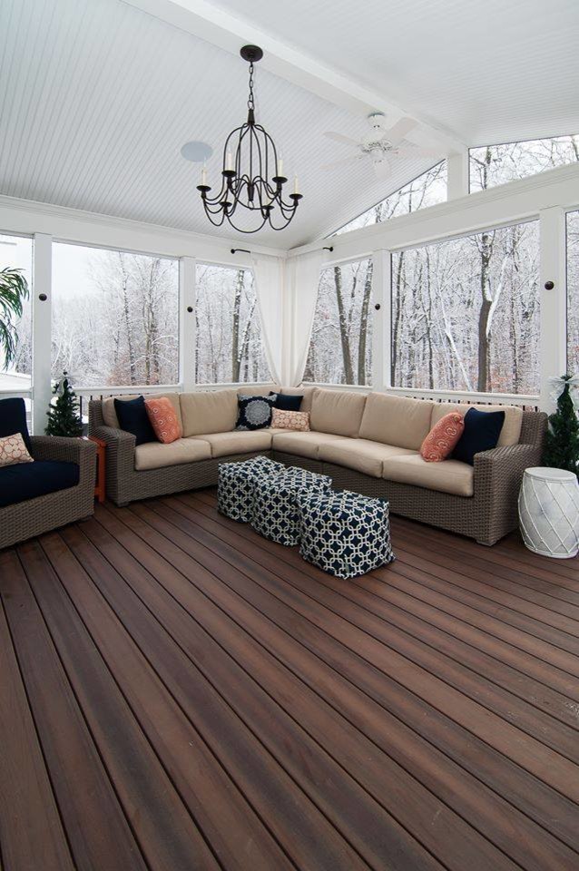 Example of a transitional backyard balcony deck design in Baltimore with a roof extension
