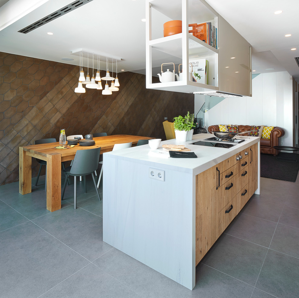 Photo of a contemporary eat-in kitchen in Barcelona with with island.