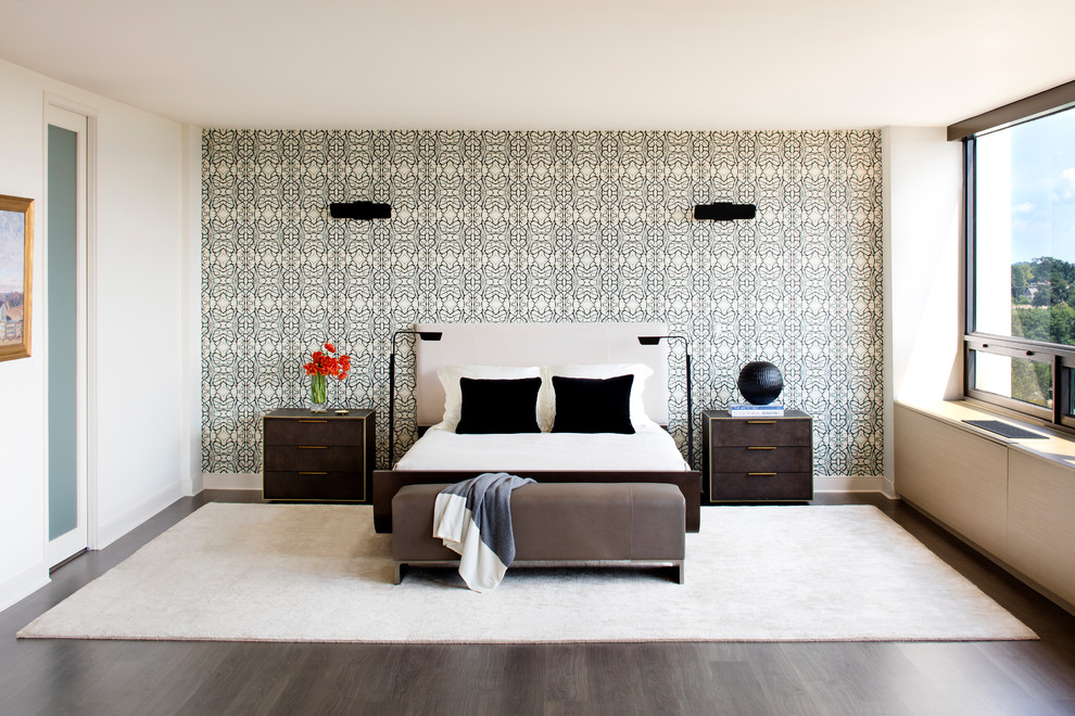 Inspiration for a small contemporary bedroom in Bridgeport with white walls and dark hardwood floors.