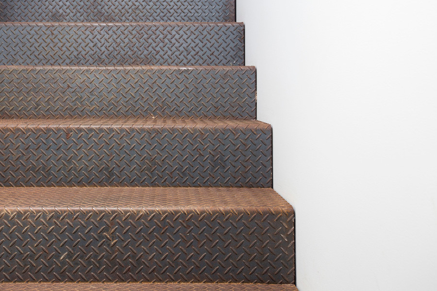 This is an example of a mid-sized country metal straight staircase in Sydney with metal risers.