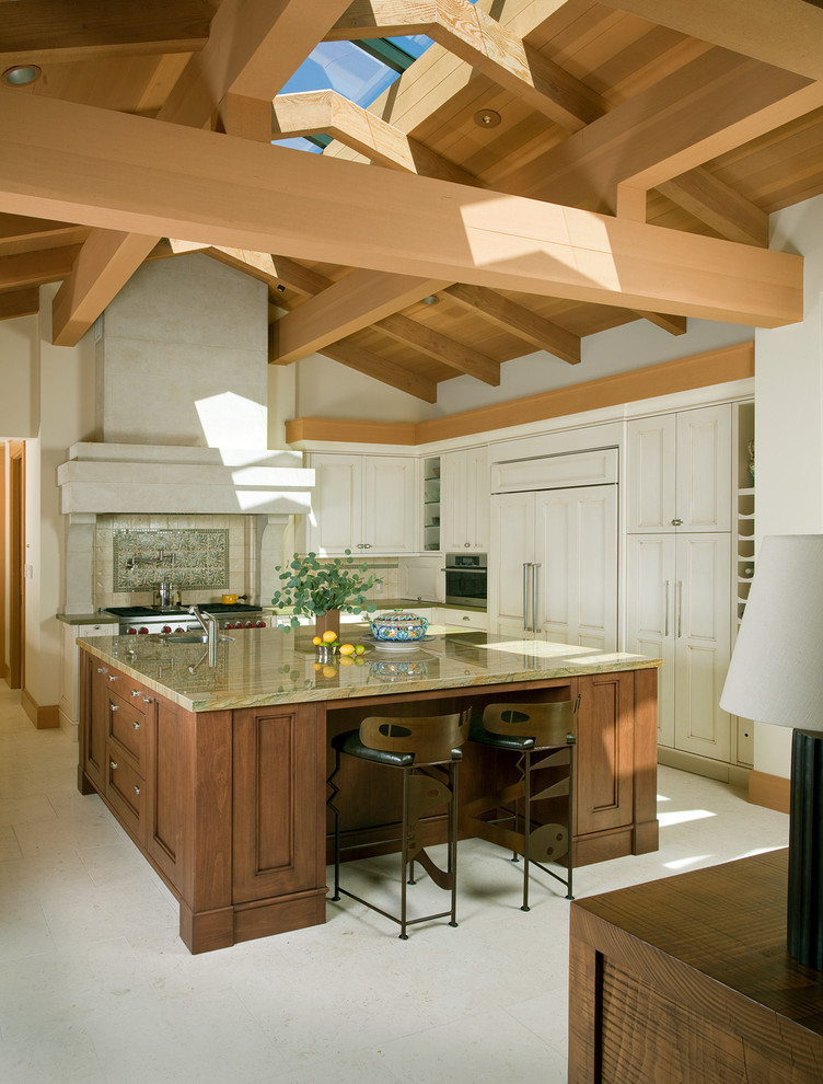Photo of an eclectic l-shaped kitchen in San Francisco with recessed-panel cabinets and white cabinets.