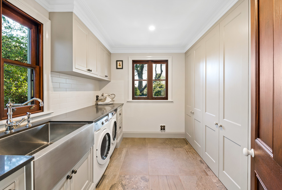 This is an example of a traditional laundry room in Other.