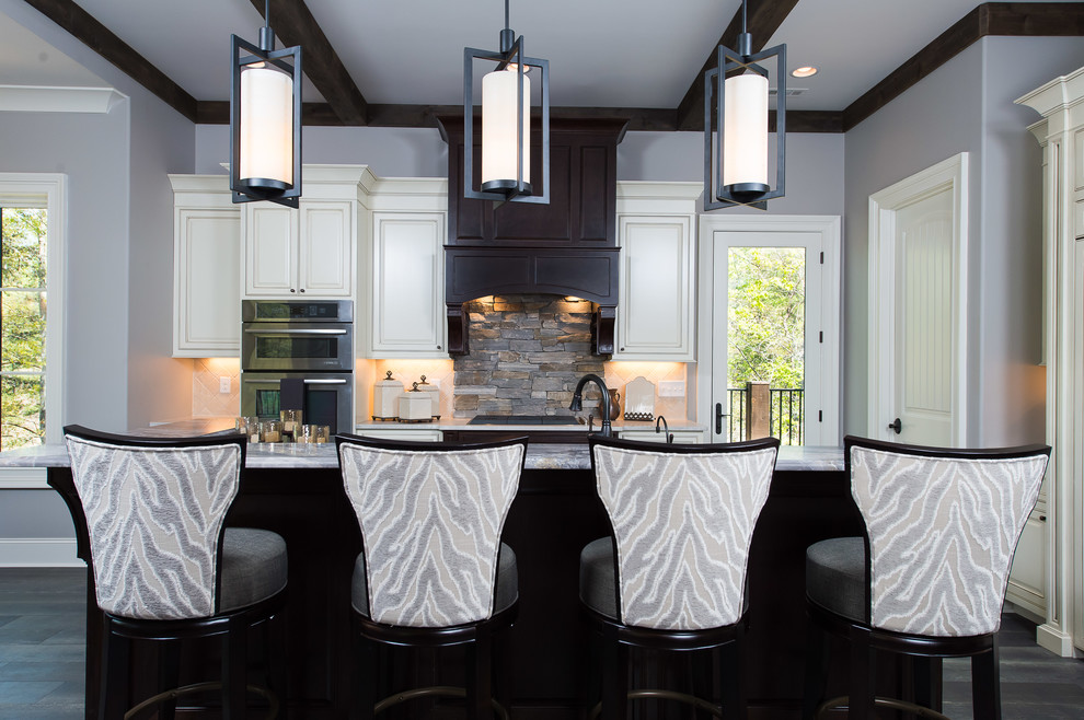 Inspiration for a modern l-shaped medium tone wood floor eat-in kitchen remodel with raised-panel cabinets, white cabinets, marble countertops, stainless steel appliances and an island