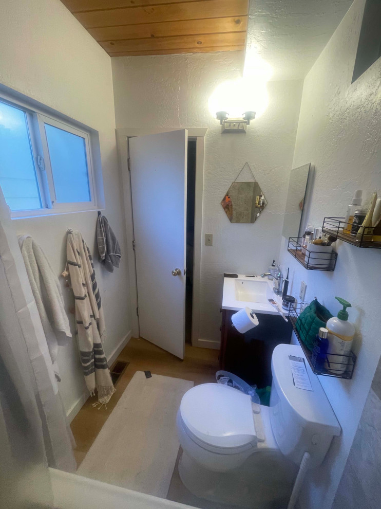 How do I work with pine ceilings and dated tile in this tiny bathroom?