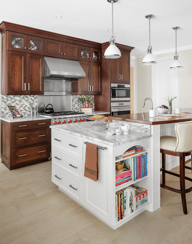Inspiration for a transitional kitchen remodel in Providence with shaker cabinets, dark wood cabinets, gray backsplash, stainless steel appliances and an island