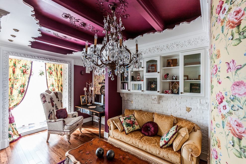Design ideas for an eclectic study room in Saint Petersburg with purple walls, medium hardwood floors, a freestanding desk and brown floor.