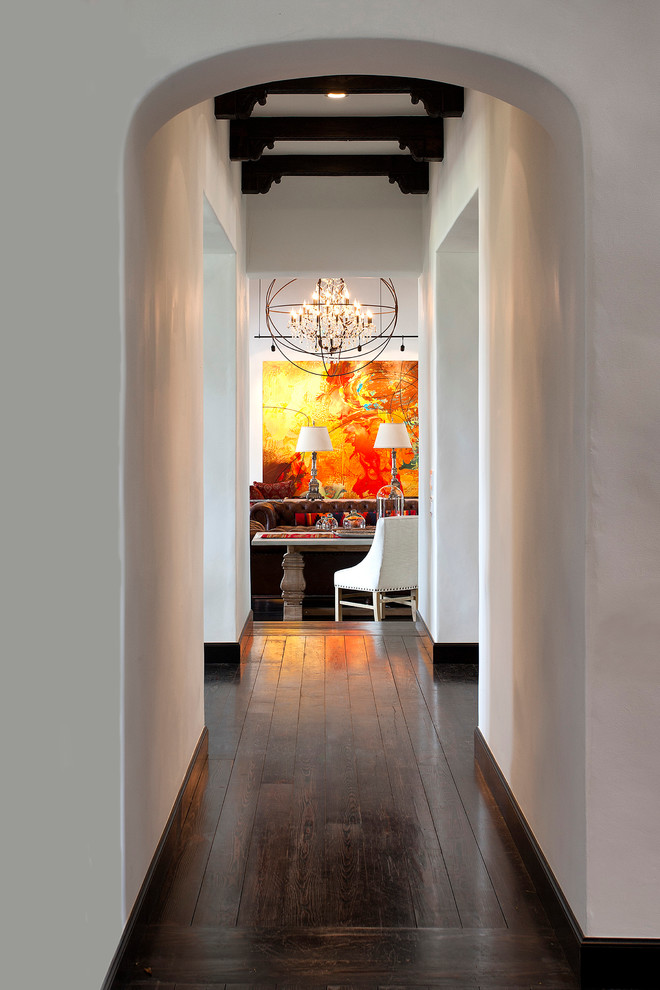 Inspiration for a mid-sized mediterranean dark wood floor hallway remodel in Other with white walls