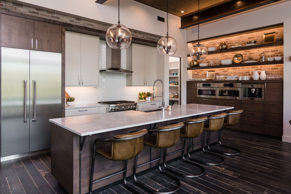 Inspiration for a contemporary kitchen in Boise with open cabinets, dark wood cabinets, white splashback, stainless steel appliances, dark hardwood floors and with island.
