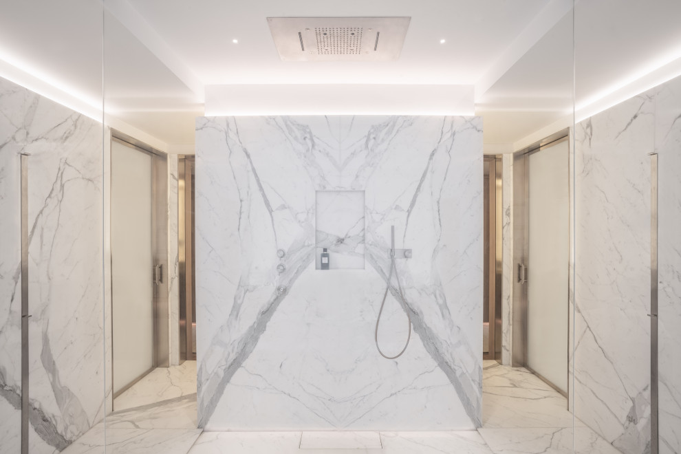 Large modern 3/4 bathroom in London with flat-panel cabinets, white cabinets, a drop-in tub, an open shower, a wall-mount toilet, white walls, marble floors, marble benchtops, white floor, an open shower, white benchtops, an enclosed toilet, a single vanity, a built-in vanity and coffered.